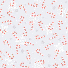 Purple  Christmas seamless pattern with blue candy cane and snowflakes