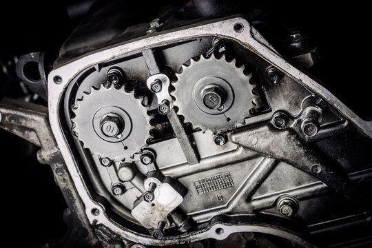 Сar engine after remove the cover part in a workshop.