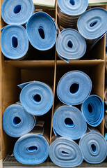 a roll of special insulation material is folded on a rack