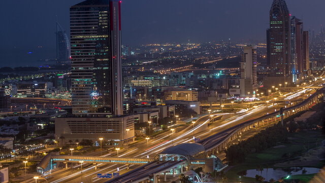 Aerial view of Sheikh Zayed Road in Dubai Internet City area night to day timelapse © neiezhmakov