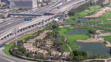 Landscape of green golf course with lakes timelapse. Dubai, UAE