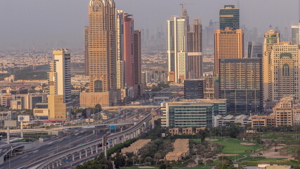 Fototapeta na wymiar Aerial view of Sheikh Zayed Road in Dubai Internet City area timelapse