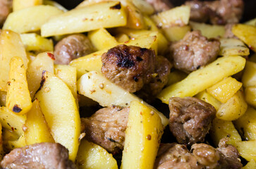 french fries with pieces of meat
