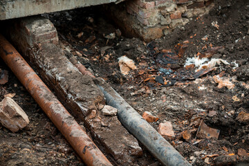 Repair of broken old rusty pipes of the water supply system.