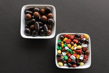 Small colored chocolates. Glazed chocolate. Sweet dragee stones. Desserts for Candy Bar. Small multi-colored candies.