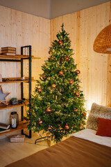 new year decor for bedroom. Christmas tree in bedroom by bed with wreath on wall