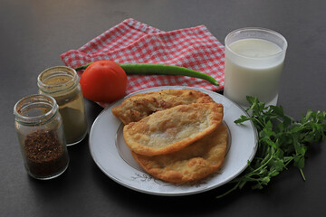 Fototapeta na wymiar Traditional delicious Turkish foods,minced meat in savory pastry (Turkish name ; Çiğ börek)