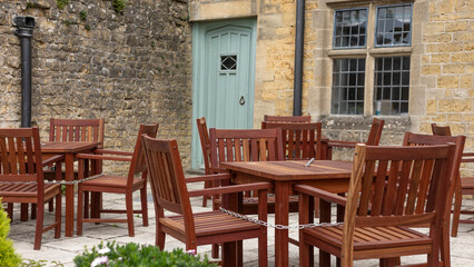 Fototapeta na wymiar Outdoor dining area with wooden seats