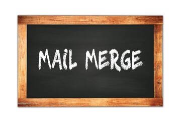 Obraz premium MAIL MERGE text written on wooden frame school blackboard.