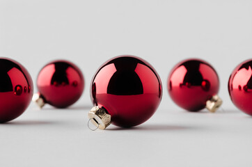 Multiple red glossy Christmas balls mockup on a seamless grey background.