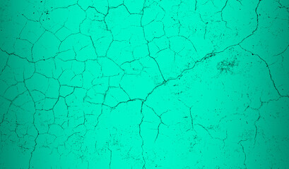 Seamless cracked pattern texture on a bright teal color concrete wall