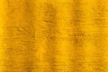 Gold color old cement wall with rough texture for background