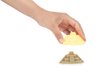 Hand holding plastic Castle of beach toys isolated on white background