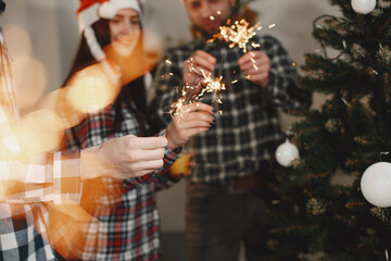Young people celebrating New Year at home party