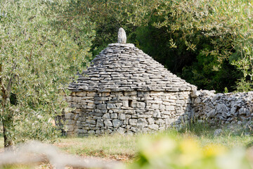 A Kazun is a native Mediterranean round house with conical roof. The house is built of dry stone without any other material. It is used as a shelter or for storage... - 472877917
