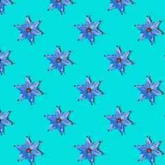 Seamless Christmas texture of stars on a blue background. Pattern