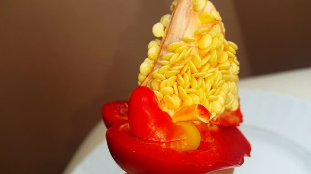 red pepper seeds in white plate