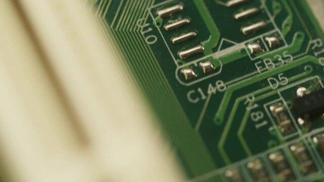 Microchip close-up, computer processor, motherboard. microcircuit details macro shooting. Repair service and technology concept.