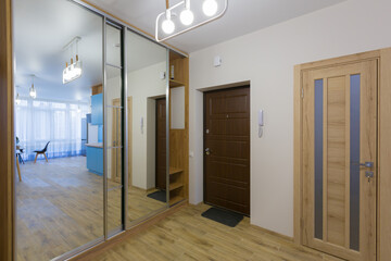 Interior of corridors in a large apartment with white walls