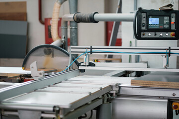 Cnc circular saw sawing chipboard. Process of making cabinet furniture.