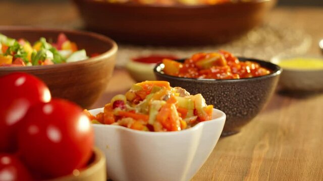 Moroccan cuisine. Traditional dishes, vegetable salad. Middle eastern culture. Homemade food. Bowls with sauces and cold appetizer.