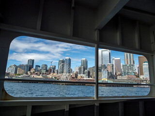 Fototapeta na wymiar Usa, Washington State, Seattle, downtown skyline viewed through the window of a ferry on Elliott Bay in Puget Sound.