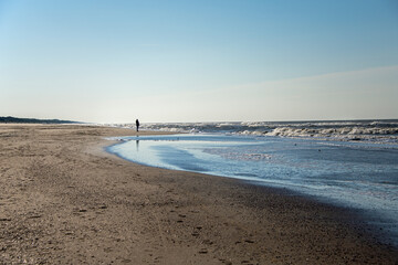 Man walking on the sea side