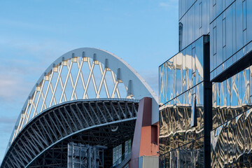 Fototapeta premium Usa, Washington State, Seattle, roof of Safeco Field stadium and glass office tower.