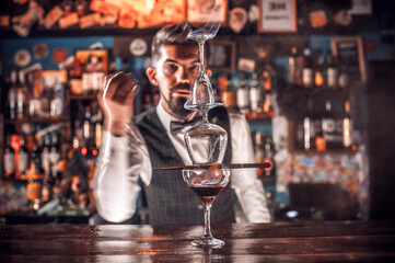 Bartender makes a cocktail on the public house