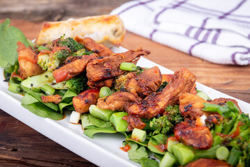 Sweet and spicy chicken with broccoli