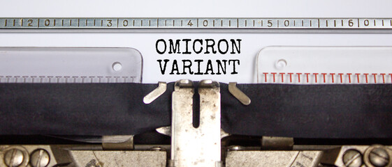 Covid-19 new omicron virus variant symbol. Concept words Omicron variant typed on retro typewriter....