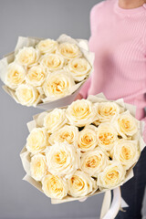 Two beautiful bouquets of peony-shaped white cream roses for mom and daughter.