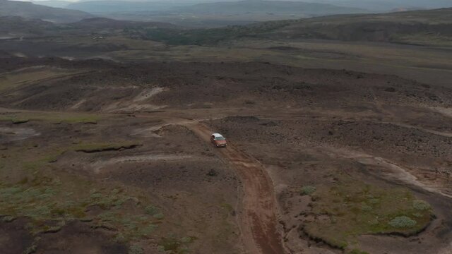 Aerial view car parked in desolate countryside off road in Iceland. Drone view of icelandic highlands with four by four parked for adventurous expedition