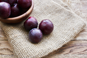 plums fruits natural products on a wooden table top view