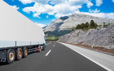 White truck on the highway. White truck on asphalt road.