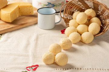 Cheese bread, breakfast table in Brazil, cheese bread, coffee and accessories, selective focus.
