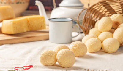 Cheese bread, breakfast table in Brazil, cheese bread, coffee and accessories, selective focus.