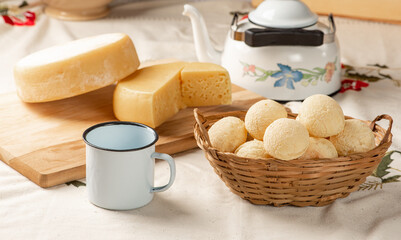 Cheese bread, breakfast table in Brazil, cheese bread, coffee and accessories, selective focus.