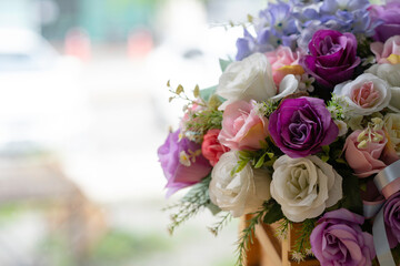 Beautiful bouquet of colorful rose petals in a vase. women's day or wedding background with copy space