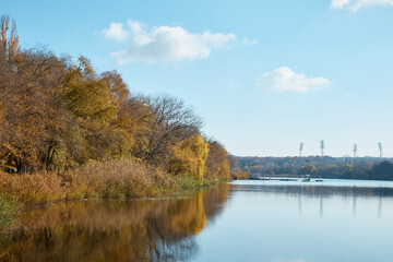 pond and forest on the shore, autumn landscape, wake park