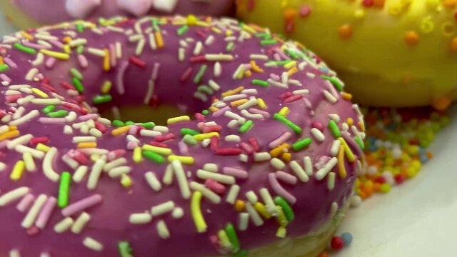 Assorted delicious donuts with icing.