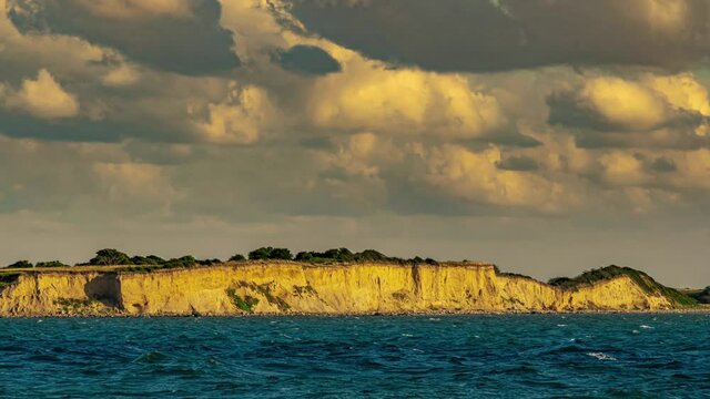 Timelapse of the cloudy sky over the cliffs of the peninsula Hindsholm. Fyns Hoved, Korshavn, Funen, Denmark