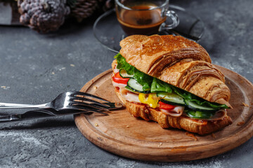New Year's breakfast with croissants. New Year's croissant with ham cheese and tomatoes. New Year and Christmas concept