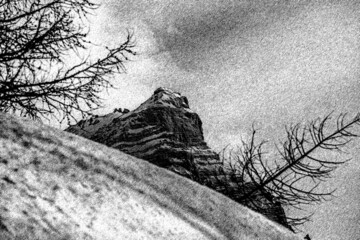 Illustration with charcoal technique of part of Mount Pelmo north face in winter conditions. Selva di Cadore, Dolomites, Italy