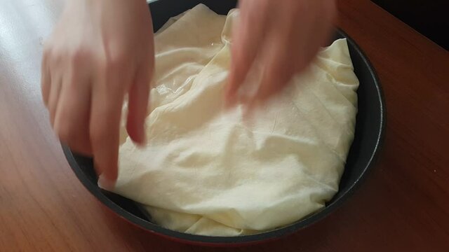 Video image of making pastry at home in a pan