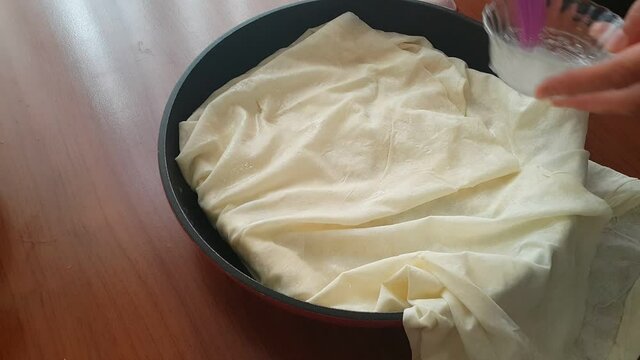 Video image of making pastry at home in a pan