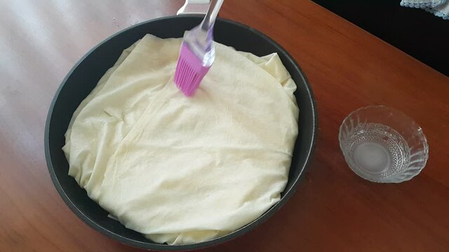 Video image of making pastry at home in a pan