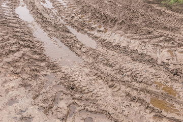 Track pattern trail from vehicle on dirty sandy road soil from wheel texture background