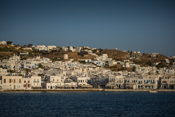 Fototapeta na wymiar Mykonos, Greece -Summer of 2021 – Typical Greek architecture on a hill. 