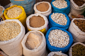 Legumes bean seeds in sack, top view, Puno fresh food market, Peru